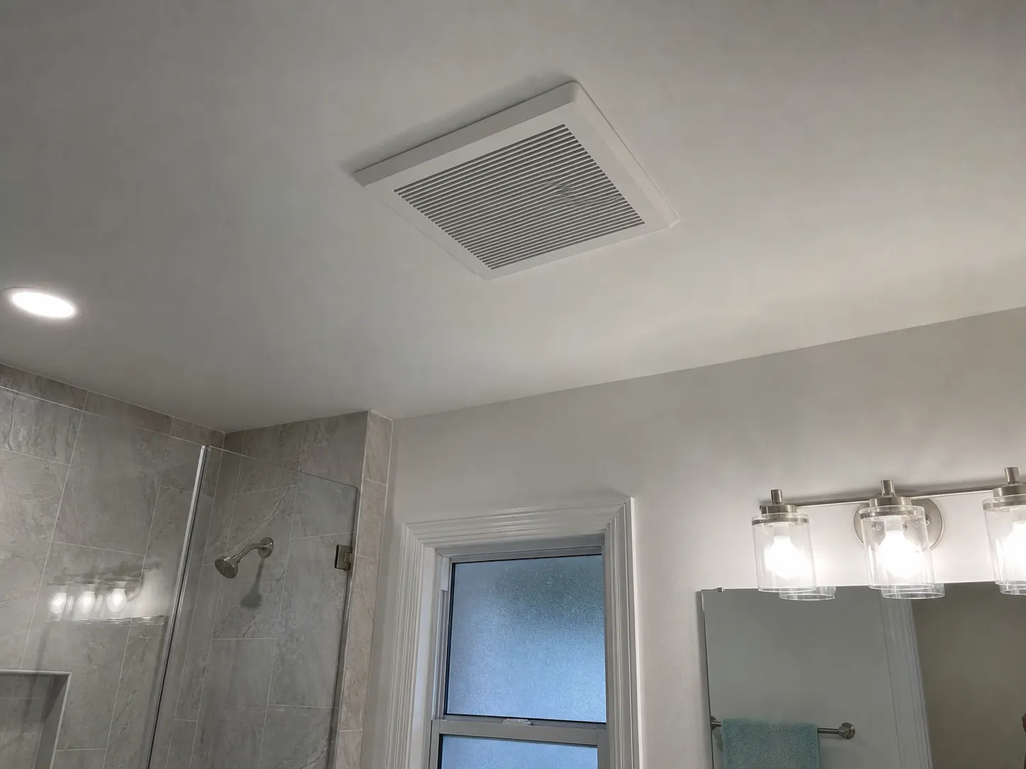 Bathroom exhaust fan installed in the ceiling